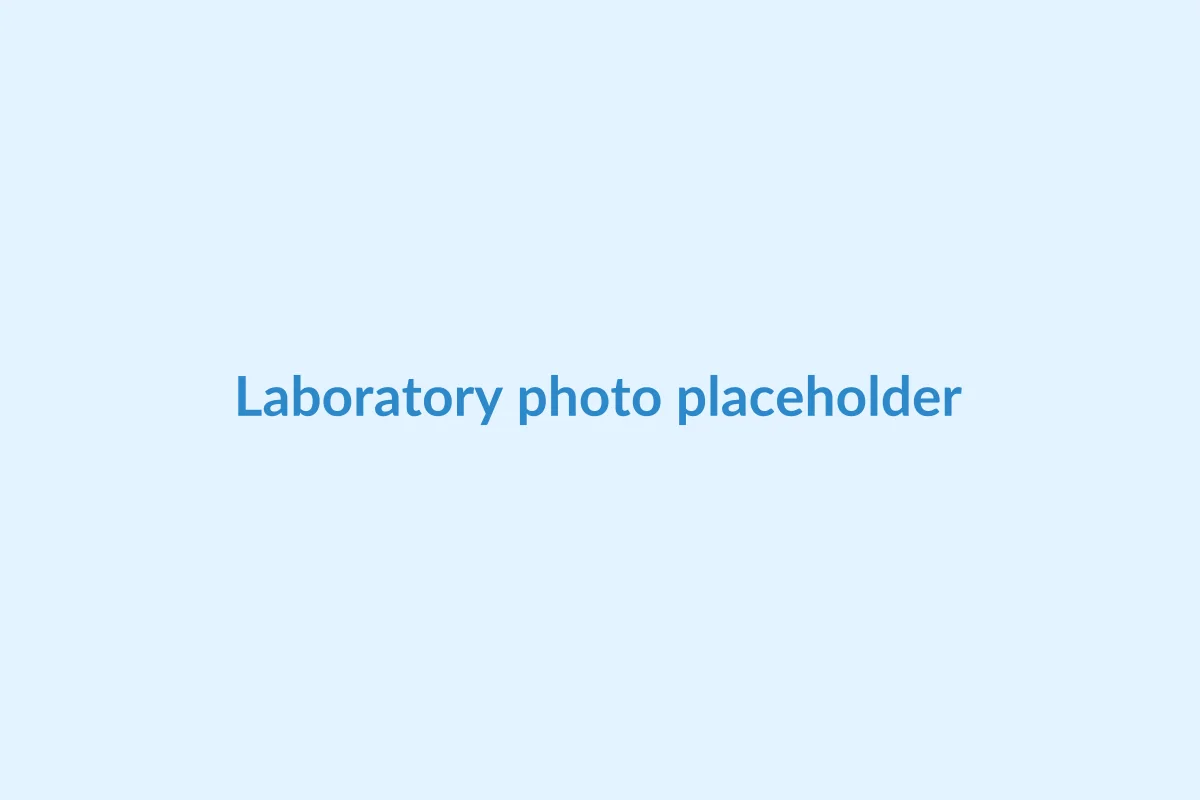 Laboratory bench with lyophilized peptide vials and analytical equipment